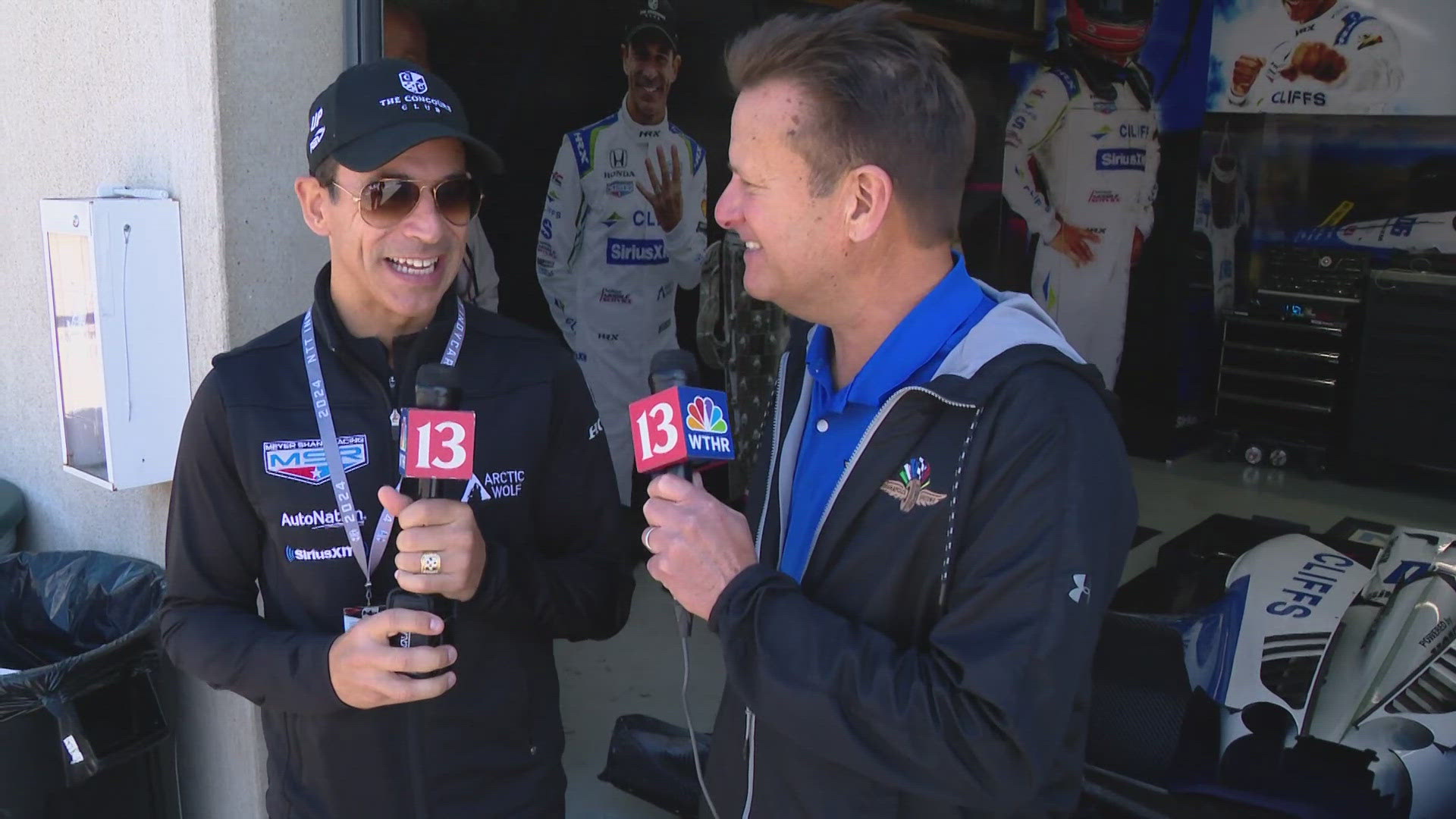 13Sports director Dave Calabro talks with 4-time Indianapolis 500 winner Helio Castroneves at the Sonsio Grand Prix at the Indianapolis Motor Speedway road course.