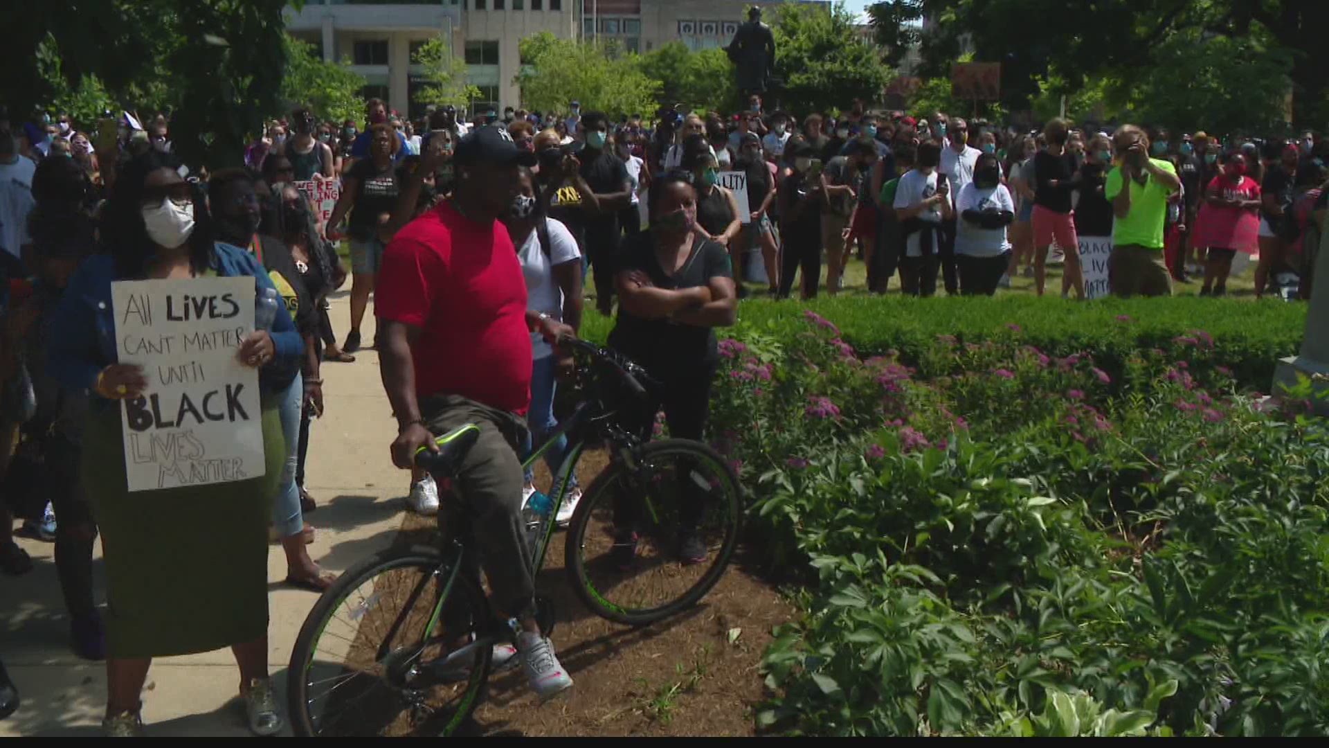 On the lawn of the State House Sunday, protesters gathered by the hundreds to rally against police brutality and encourage people to vote.