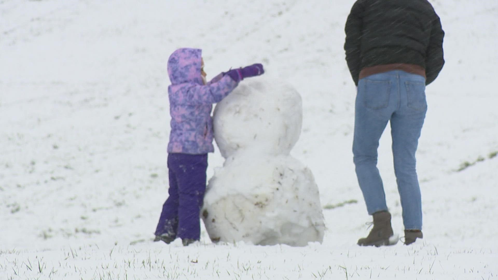 Families went sledding in Indianapolis on a day when the city recorded 2.7 inches of snow.