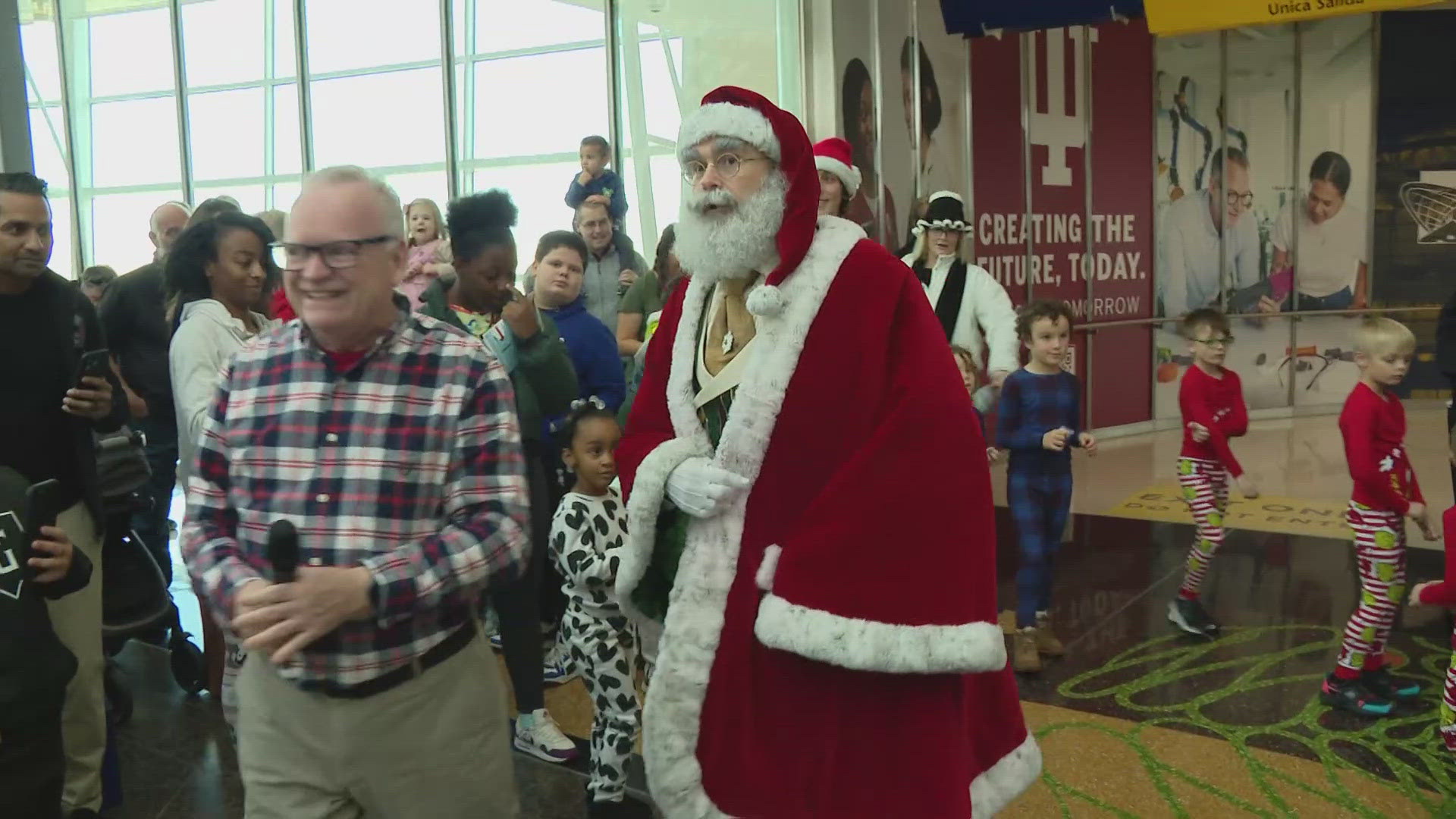 Jolly Old St. Nick stopped by the Indianapolis International Airport Saturday to say hello to more than 1,200 Hoosier families and children.