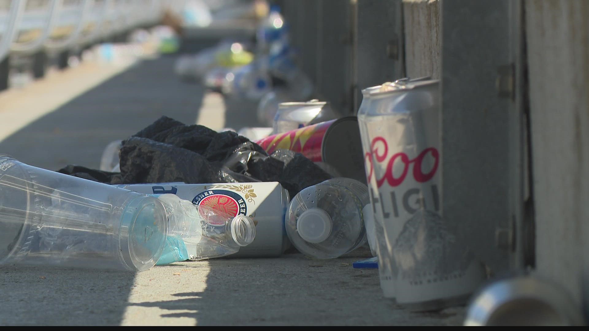 Groups of volunteers hit the track early Memorial Day morning, earning money by cleaning up trash left by Indianapolis 500 fans.