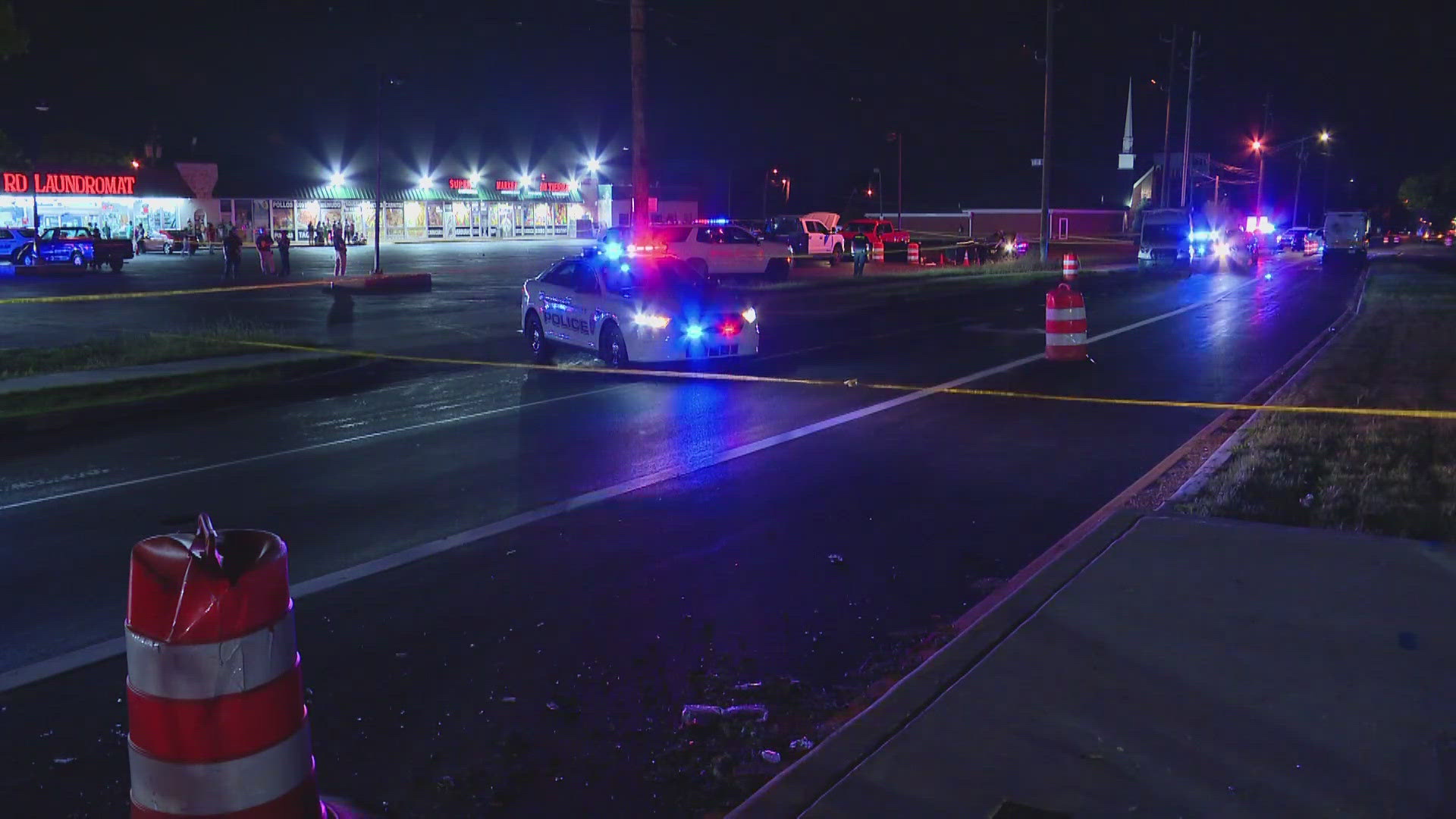 Surveillance cameras show people nearby scrambling for cover during the gunfire.