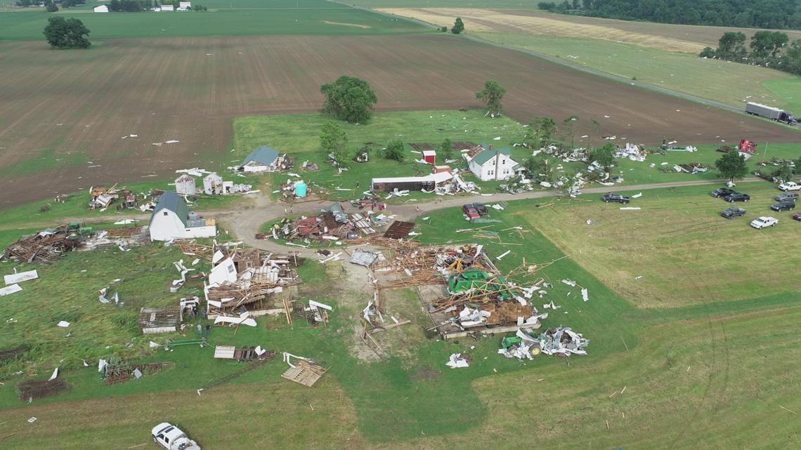 Jay County deputies pick up and fold flag found in storm damage | wthr.com