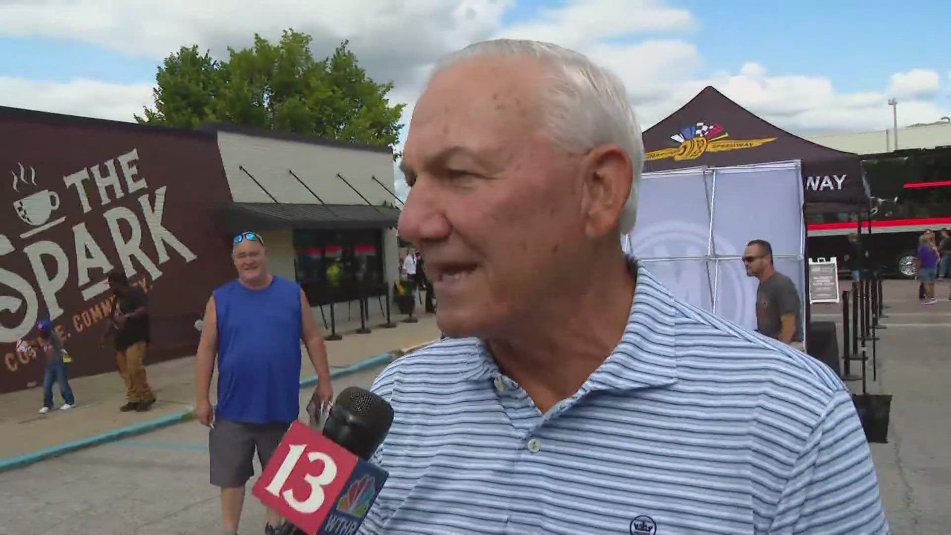 13Sports director Dave Calabro talks with the 1996 winner of the Brickyard 400, Dale Jarrett, during the NASCAR Hauler Parade.