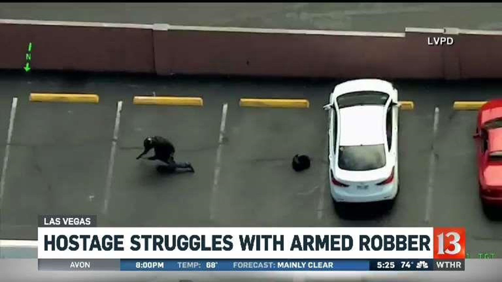 Las Vegas hostage caught on camera struggling with armed robber