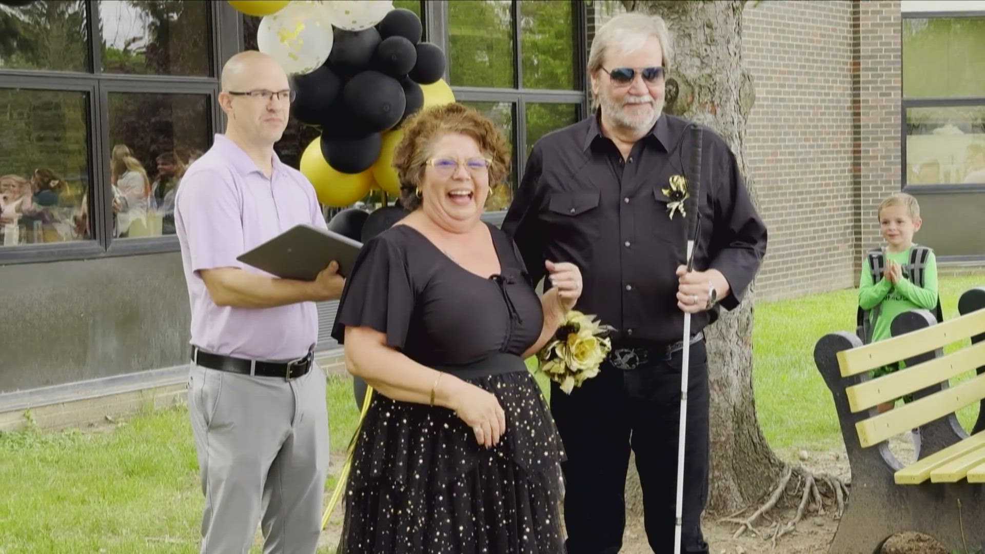 13News anchor and reporter Dustin Grove talks with Precilla Bates and Wayne Bryant who were married at a Lebanon elementary school.