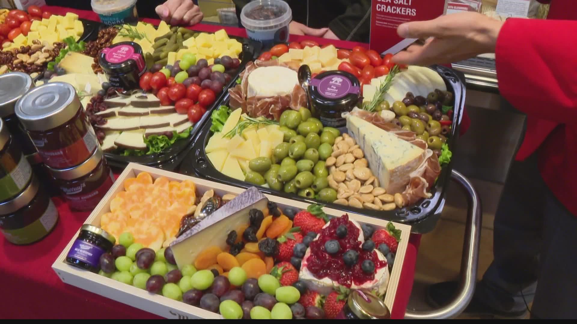 A snacking board with a variety of meats, cheeses, crackers and fruit is usually a hit for watching the big game.