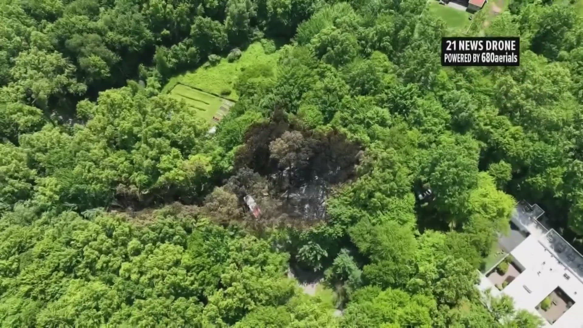 The plane went down a few miles away from the airport in the backyard of a home.