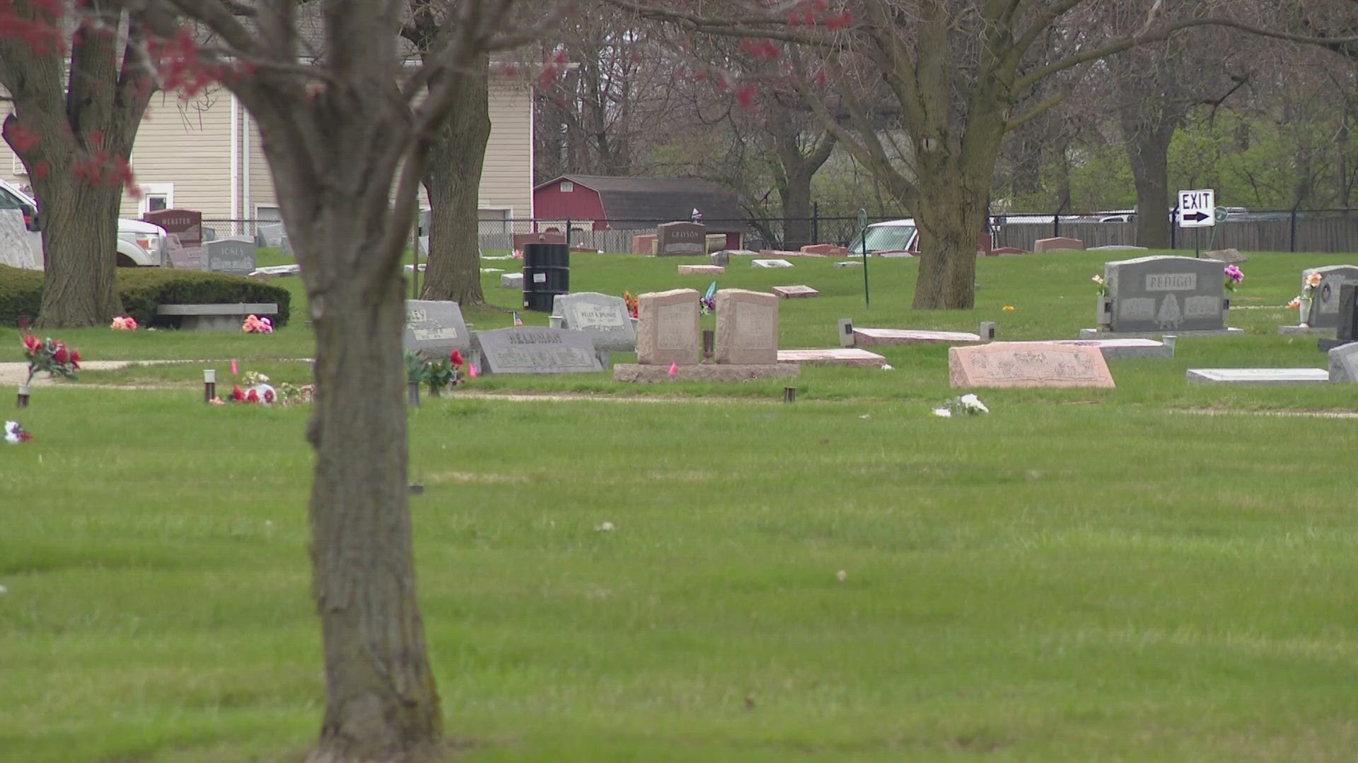 An IMPD police report says bronze vases were taken from headstones at New Crown Cemetery.