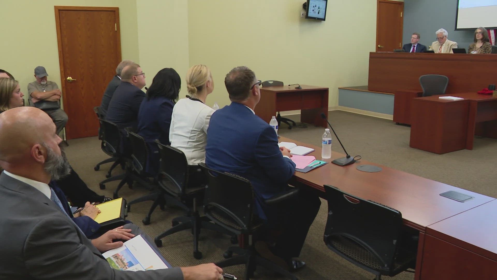 Company officials answered questions from the IURC about AES customers' billing problems.