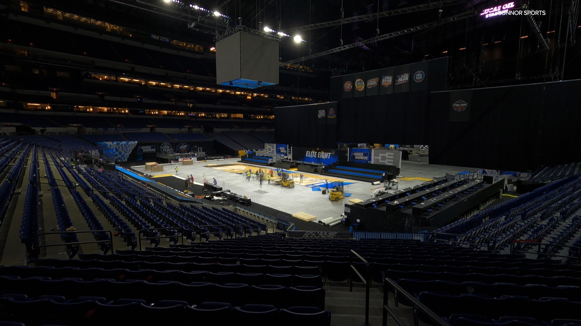 Nearly 400 panels weighing a total of 60,000 pounds slide together like a puzzle to create a basketball court made to perfection for the Final Four.