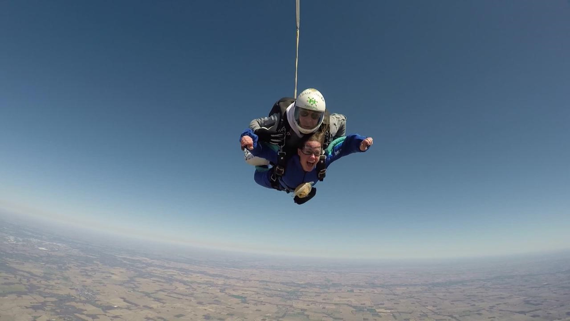 Watch Santa deliver some gifts while skydiving Red Bull