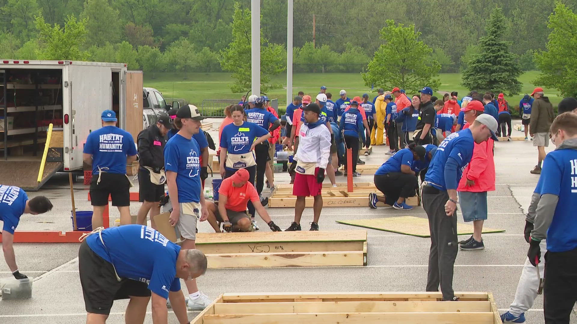 Nearly 100 volunteers from the Colts and Indiana Farm Bureau Insurance helped put together parts of a home on Friday.