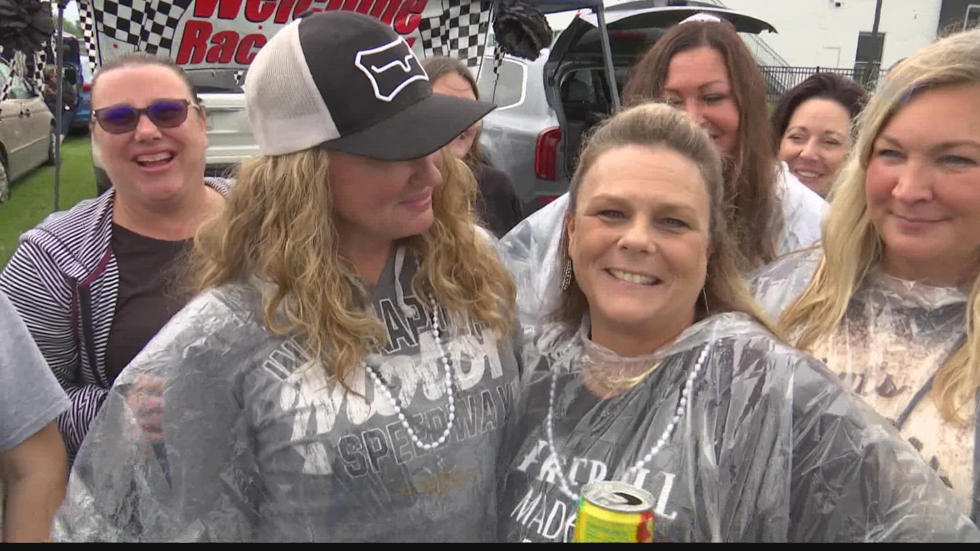 Fans waited for the track to dry, passing the time with other entertainment.