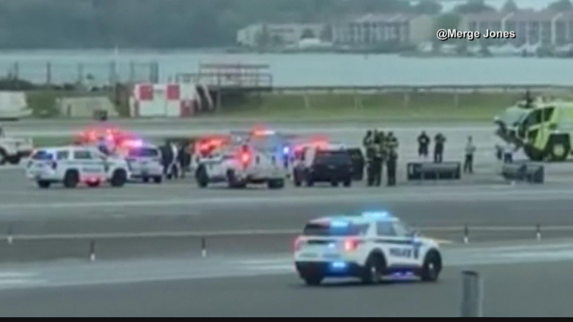 Flight 4817 landed at LaGuardia Airport where police took a passenger into custody for questioning.