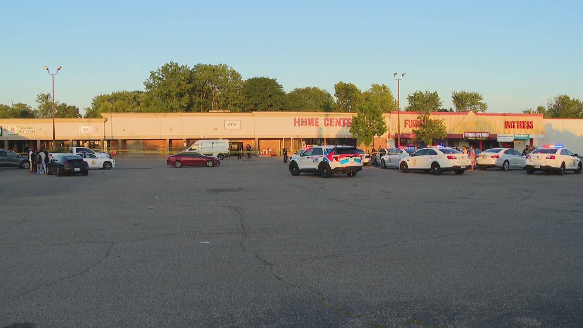 IMPD says the shots were fired in the parking lot of the Arlington Square strip mall.