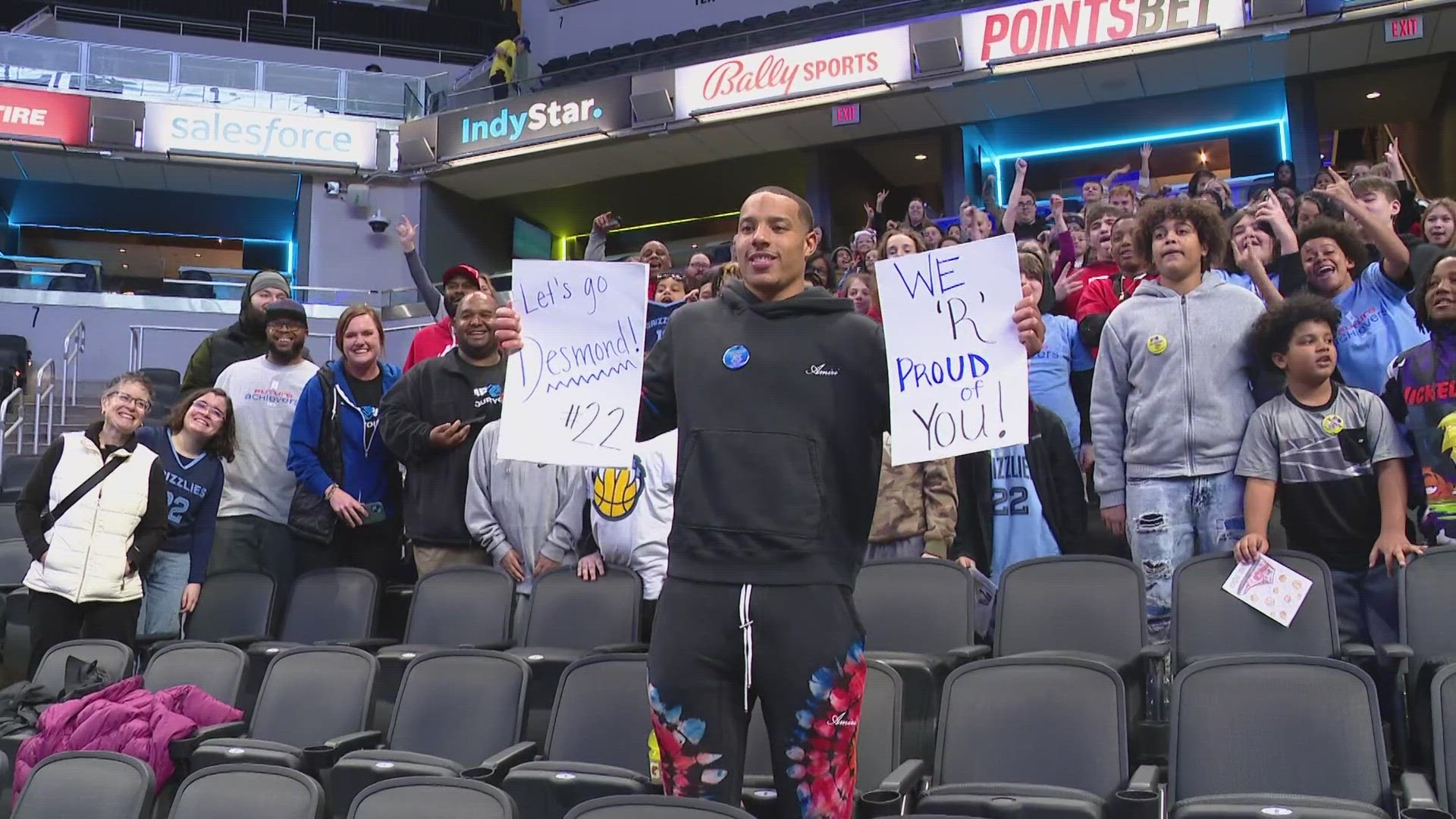 13News reporter Anna Chalker talks with some of the kids and parents visiting to cheer on Richmond native Desmond Bane of the Memphis Grizzlies.