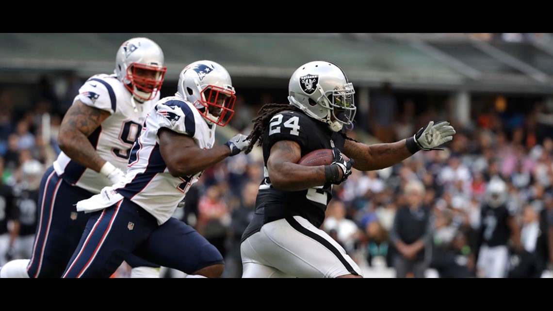 Marshawn Lynch sits during national anthem before NFL return