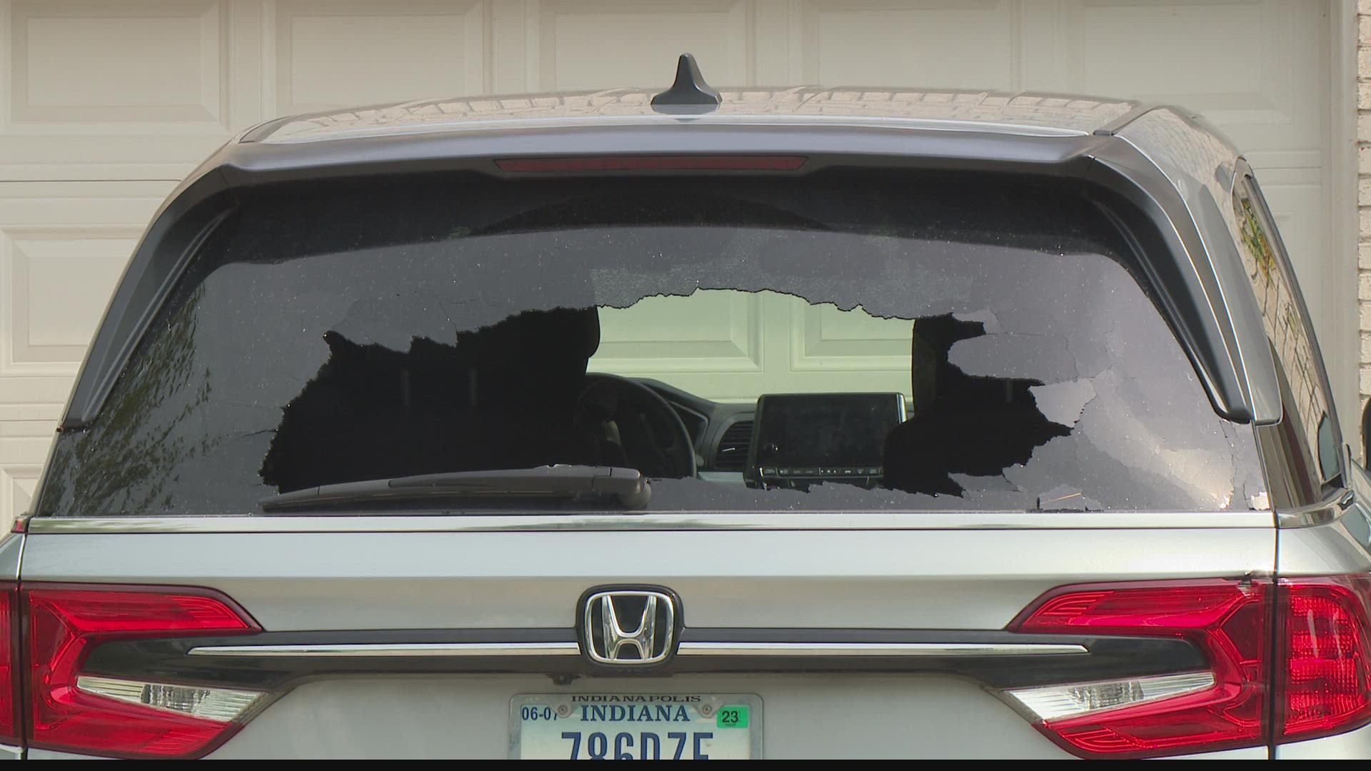Bullet holes rip through the back of a car and into a house near 131st and Promise Road in Fishers.