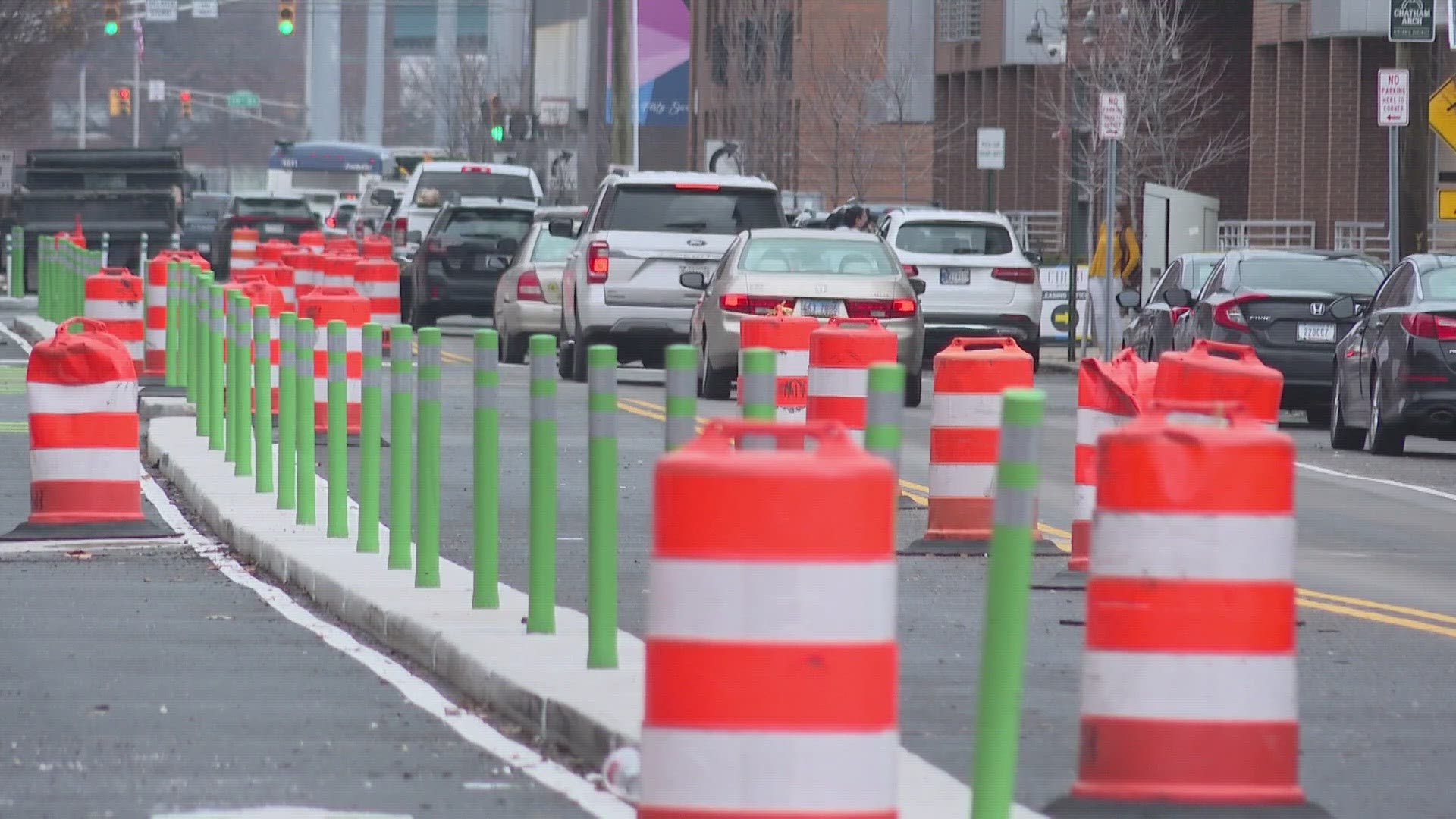 Upgrades include protected bike lanes and rectangular, rapid-flashing beacon crosswalk signals.