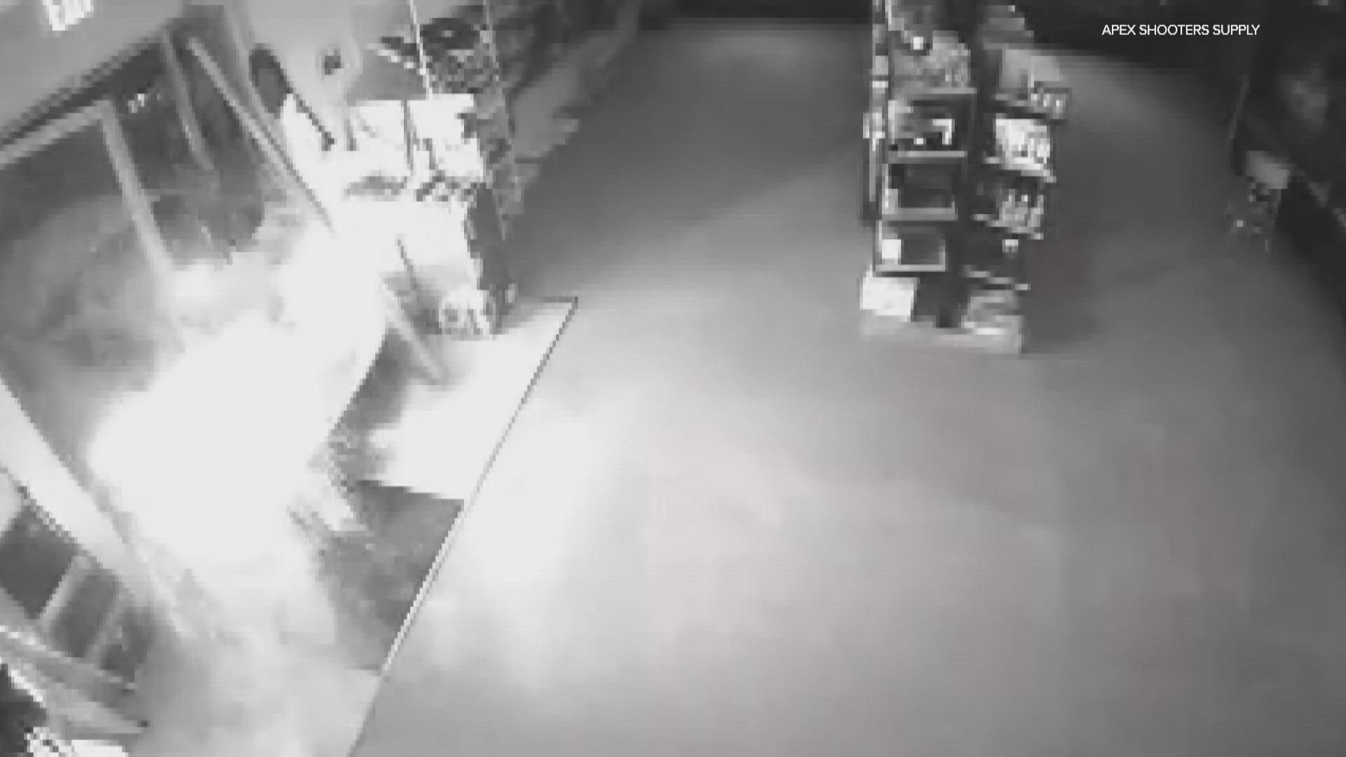 Video shows a car ramming right into the front door of Apex Shooters Supply knocking off the metal gate and shattering the glass.