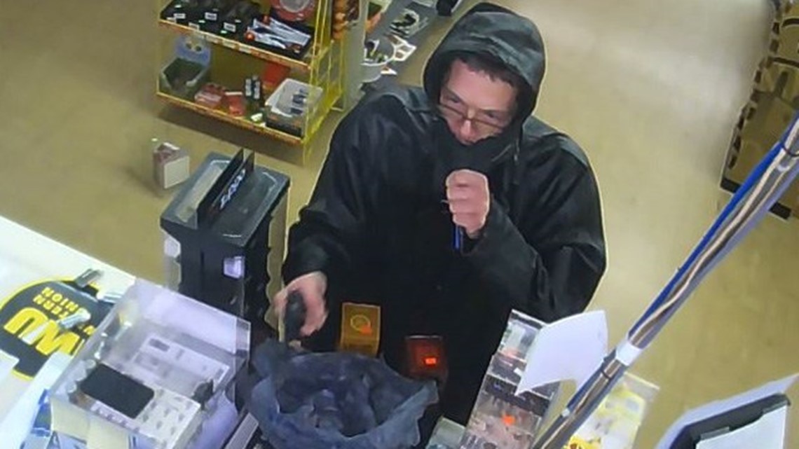 PHOTOS Greenwood armed robbery suspect caught on camera gets lesson from clerk