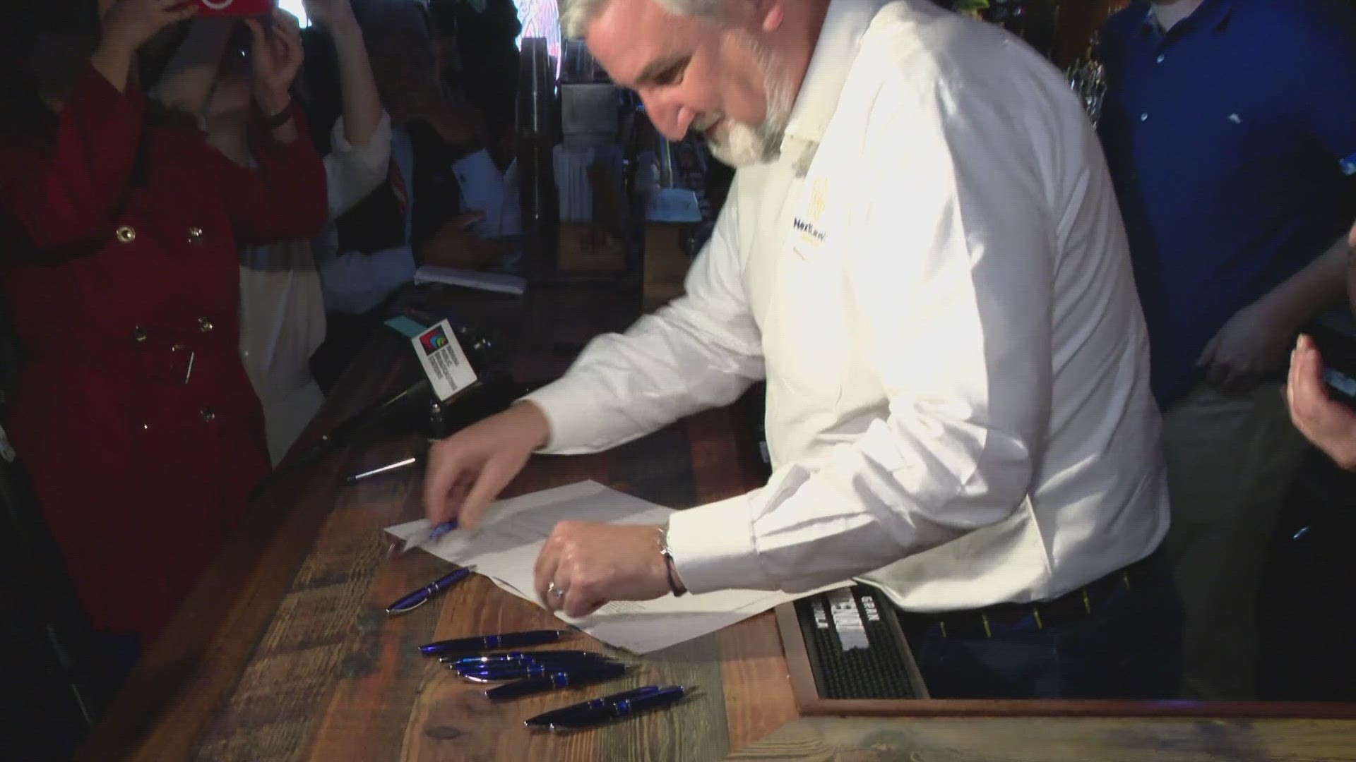 Governor Holcomb signed House Bill 10-86 into law at the Whistle Stop Inn. This law will bring back Happy Hour Drink Specials.