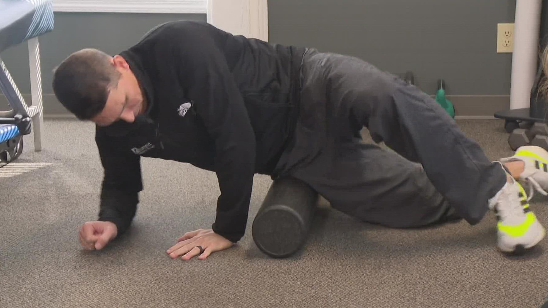 Dr. Clark Scott demonstrates how to relieve knee pain by rolling over your thigh muscle.
