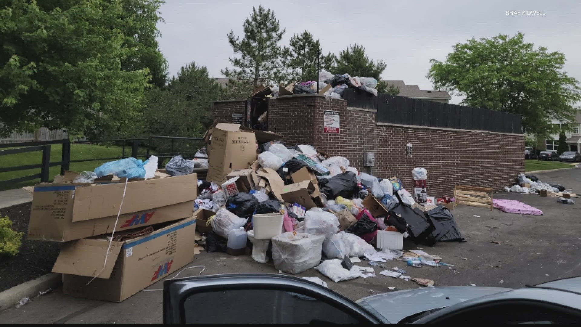 A resident shared images of a dumpster overflowing with garbage.