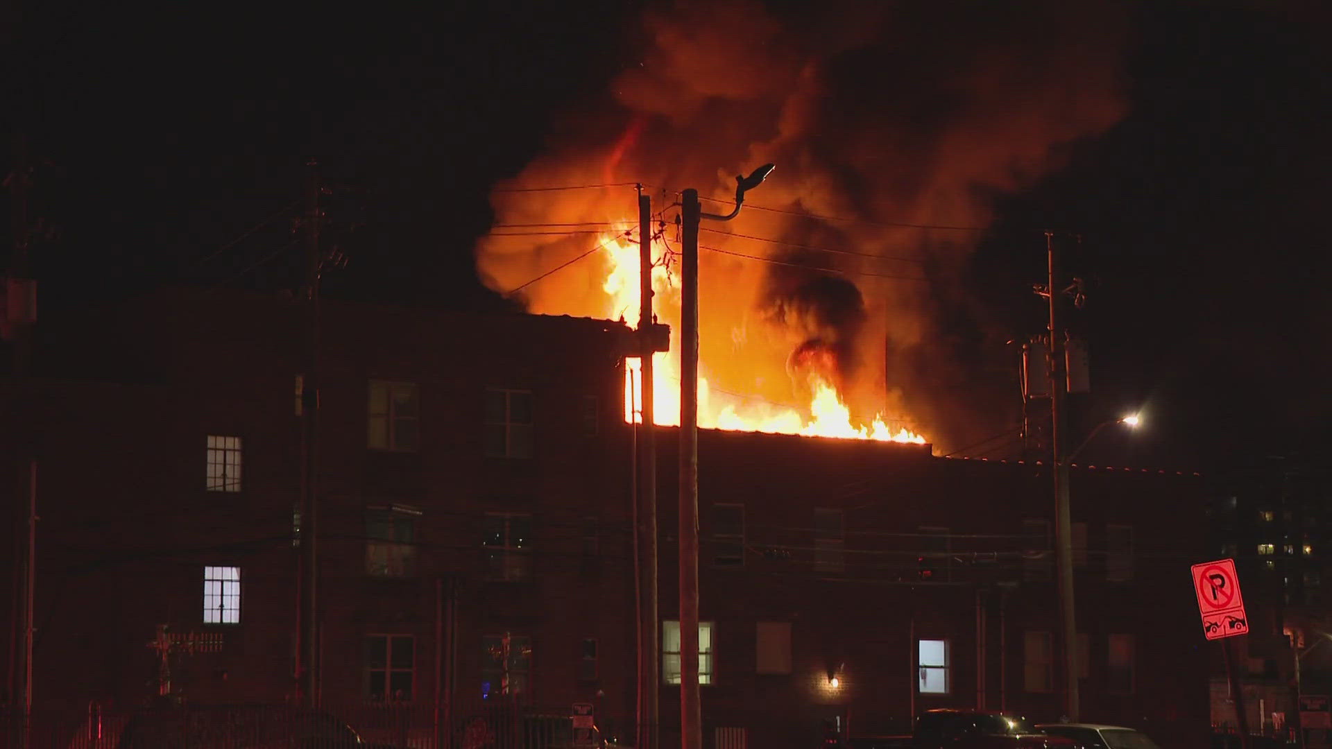 13News reporter Marina Silva talks with those who are without homes after a fire destroyed parts of the downtown Indianapolis HVAF building.