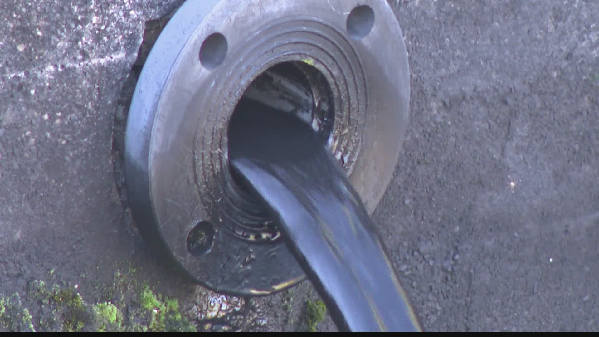 What is that black sludge flowing from a pipe just a few feet away from Fall Creek? 13 Investigates has the answer.