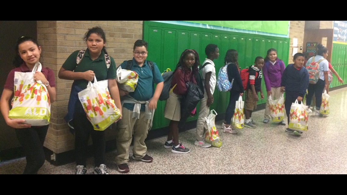 IPS teacher gives students food to take home during fall break
