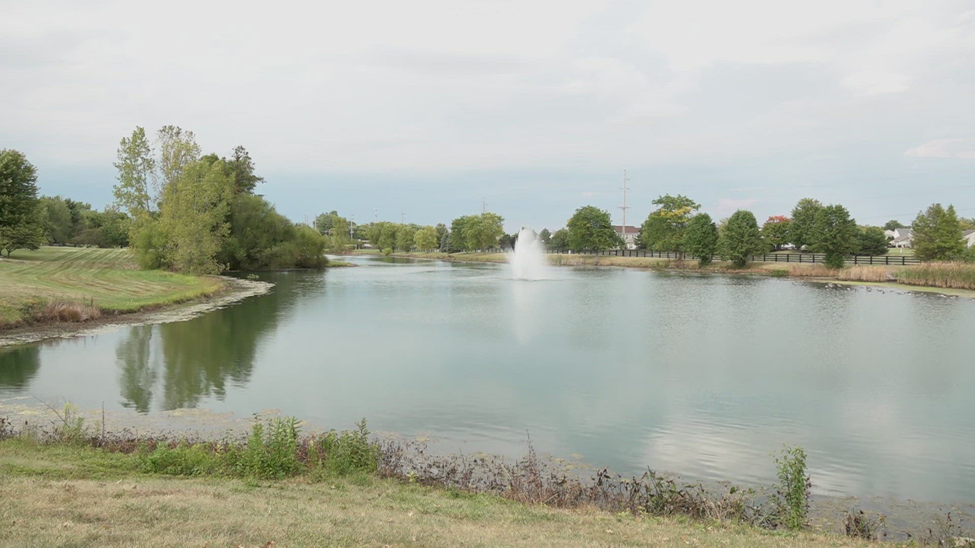 Noblesville Police say. a neighbor called 911 after seeing the man standing on top of one of the fountains.