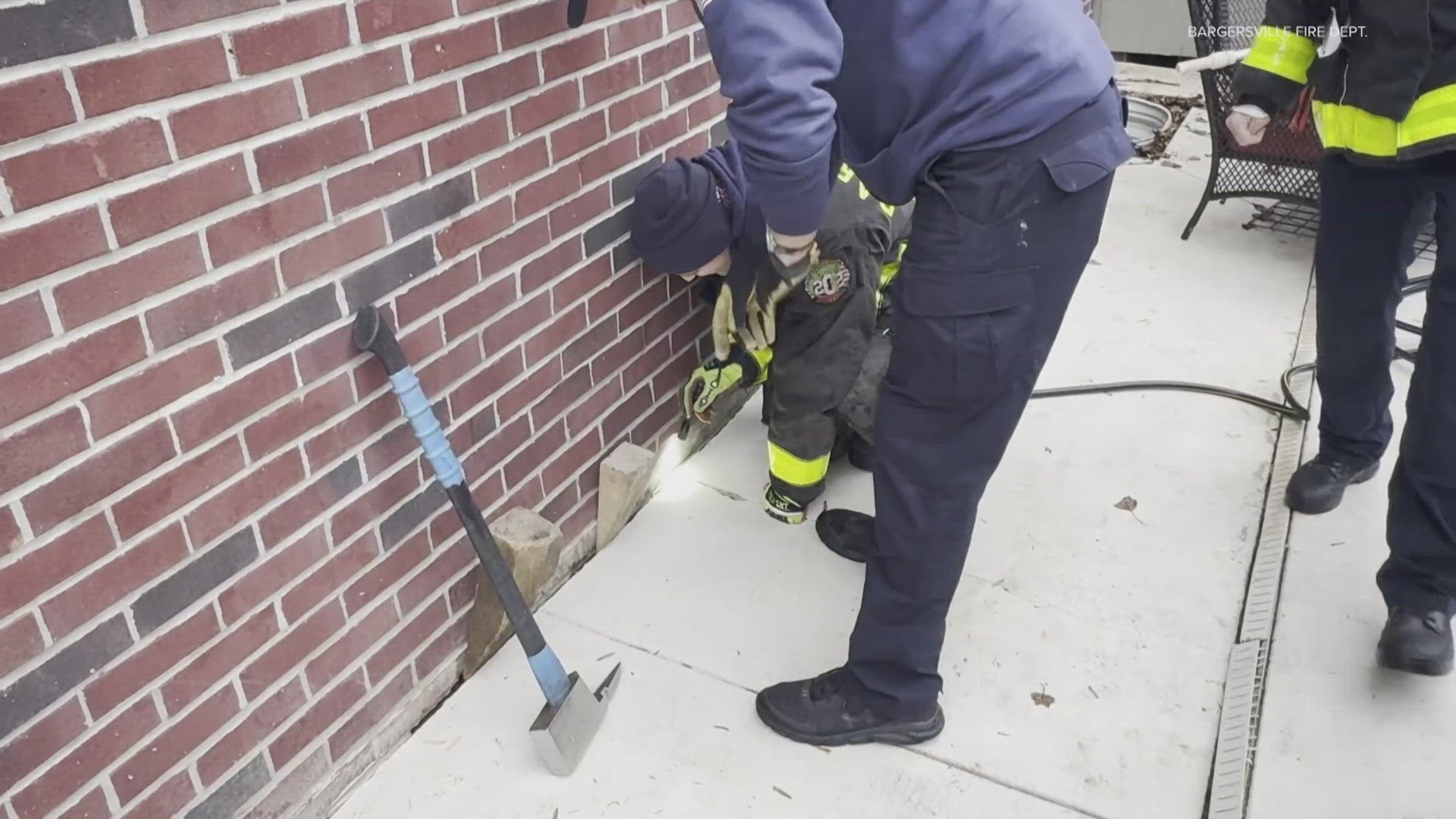 First responders had to break up a section of concrete patio to make the rescue.