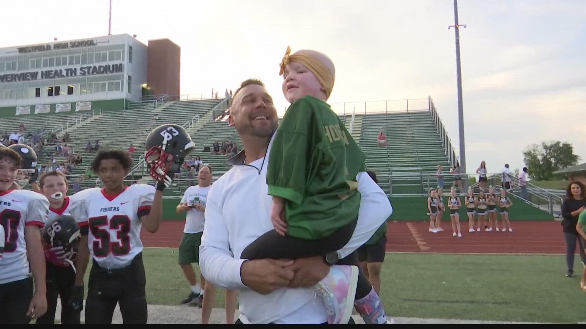 A 5-year-old pediatric cancer patient loves cheering on her older brother at his football games for Westfield Middle School.
