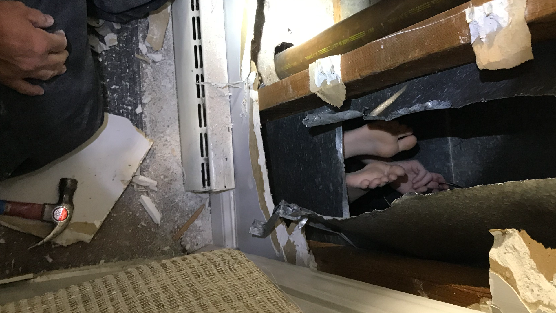 Firefighters had to rescue an 8-year-old from a laundry chute after he got stuck while trying to slide to the basement.