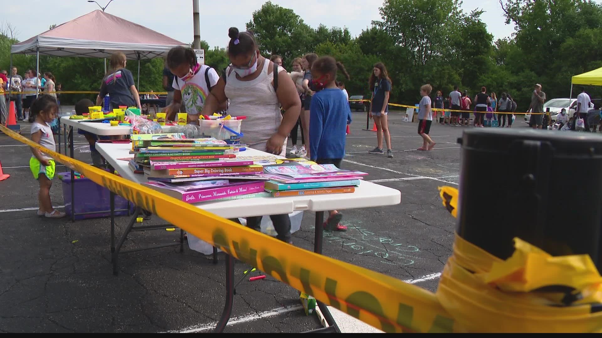 Volunteers with the nonprofit Dotted Line Divas helped hand out backpacks, health products, and classroom supplies, and also provided free haircuts.