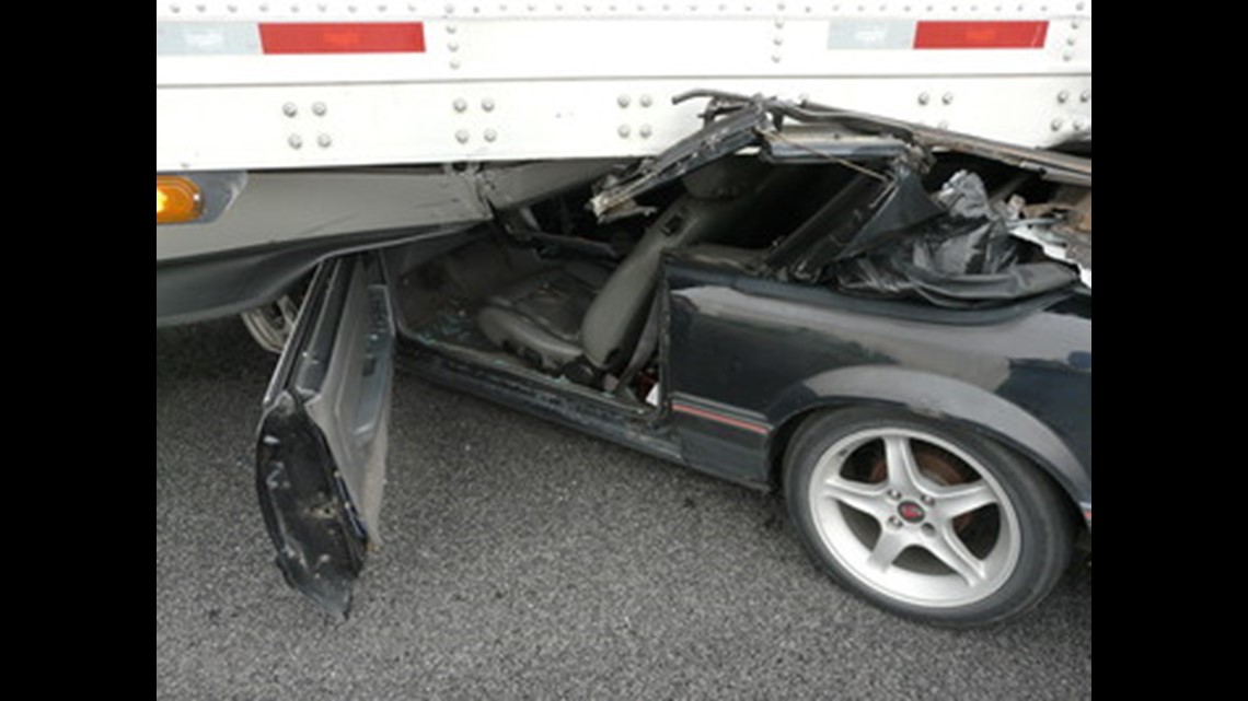 Man escapes serious injury after driving under moving semi trailer ...