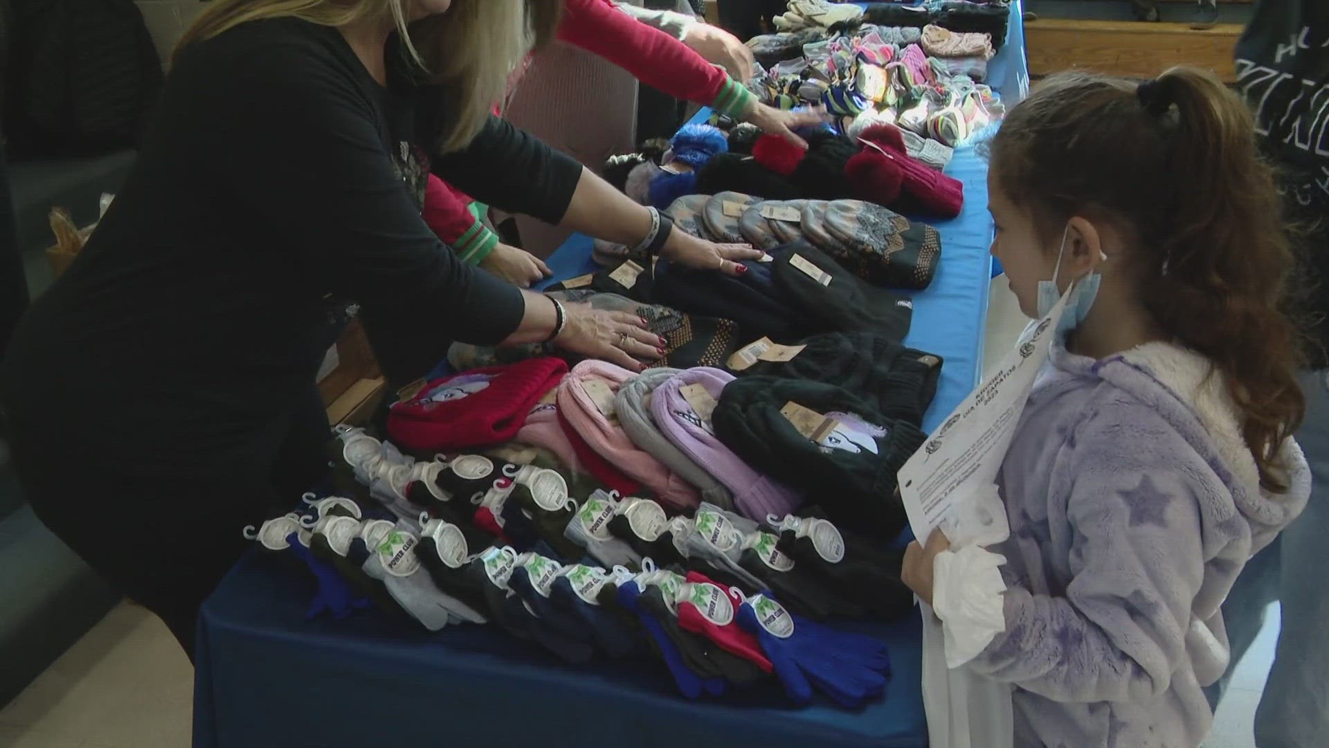 Each student got a new pair of shoes and socks, a new pair of gloves and a warm hat, plus a new toy.