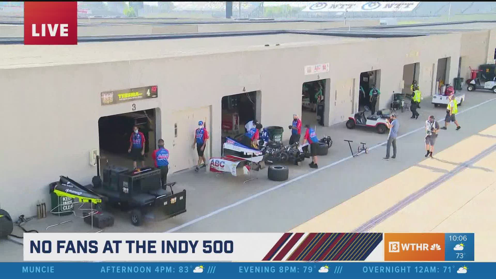 IndyCar crews are doing some last minute preparation before the cars head to the grid for the 104th Running of the Indianapolis 500.