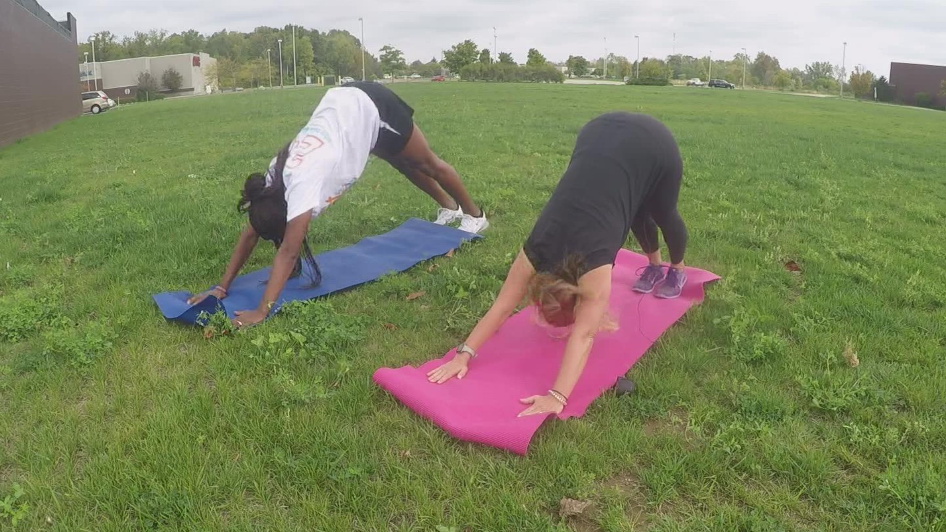 Tamika Catchings shows Anne Marie Tiernon her favorite stretches.