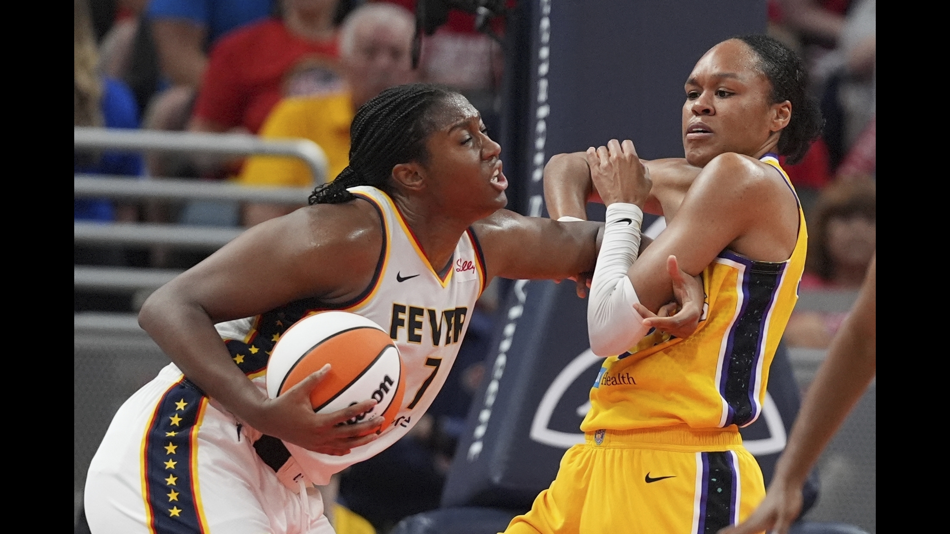 Kelsey Mitchell led five Indiana players in double figures, but Los Angeles surged in the fourth quarter to steal the win.
