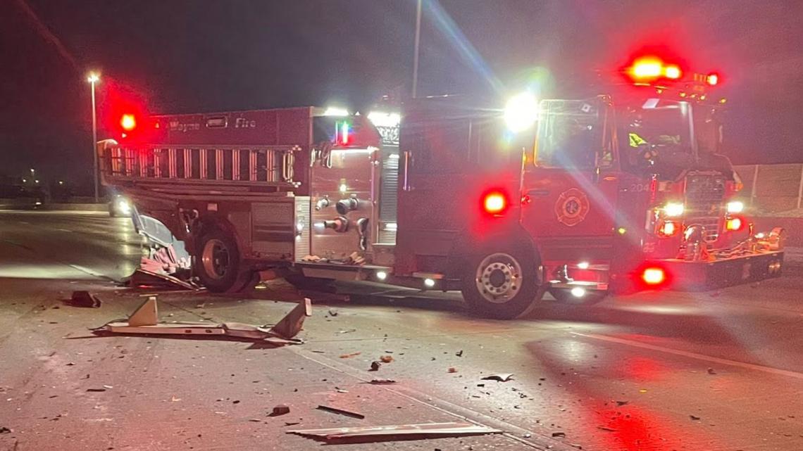 Car crashes into back of firetruck at scene of crash on I-465