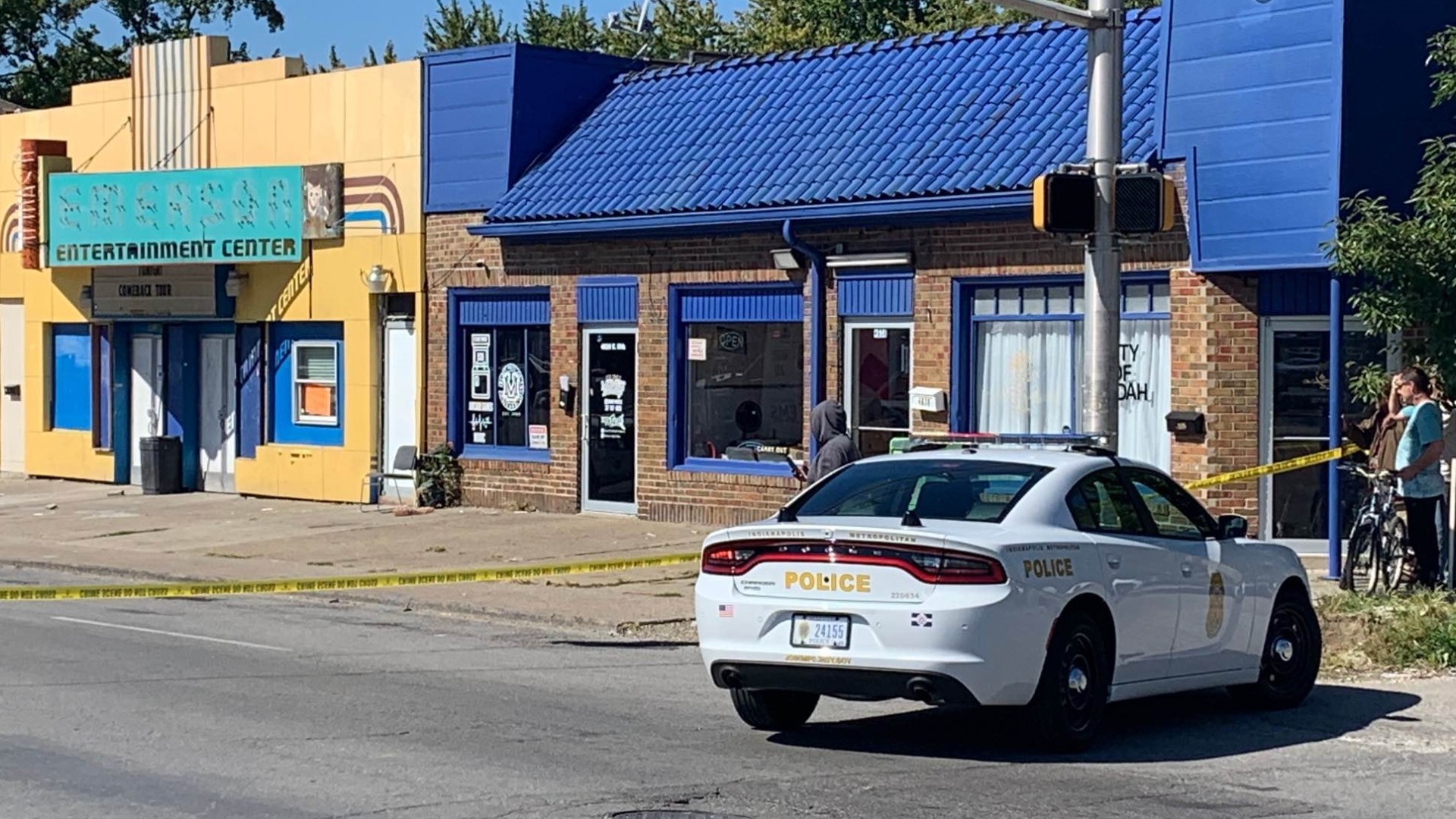 IMPD confirms a man was killed and another man and woman were wounded in a shooting inside the barber shop. Two people were detained for questioning.