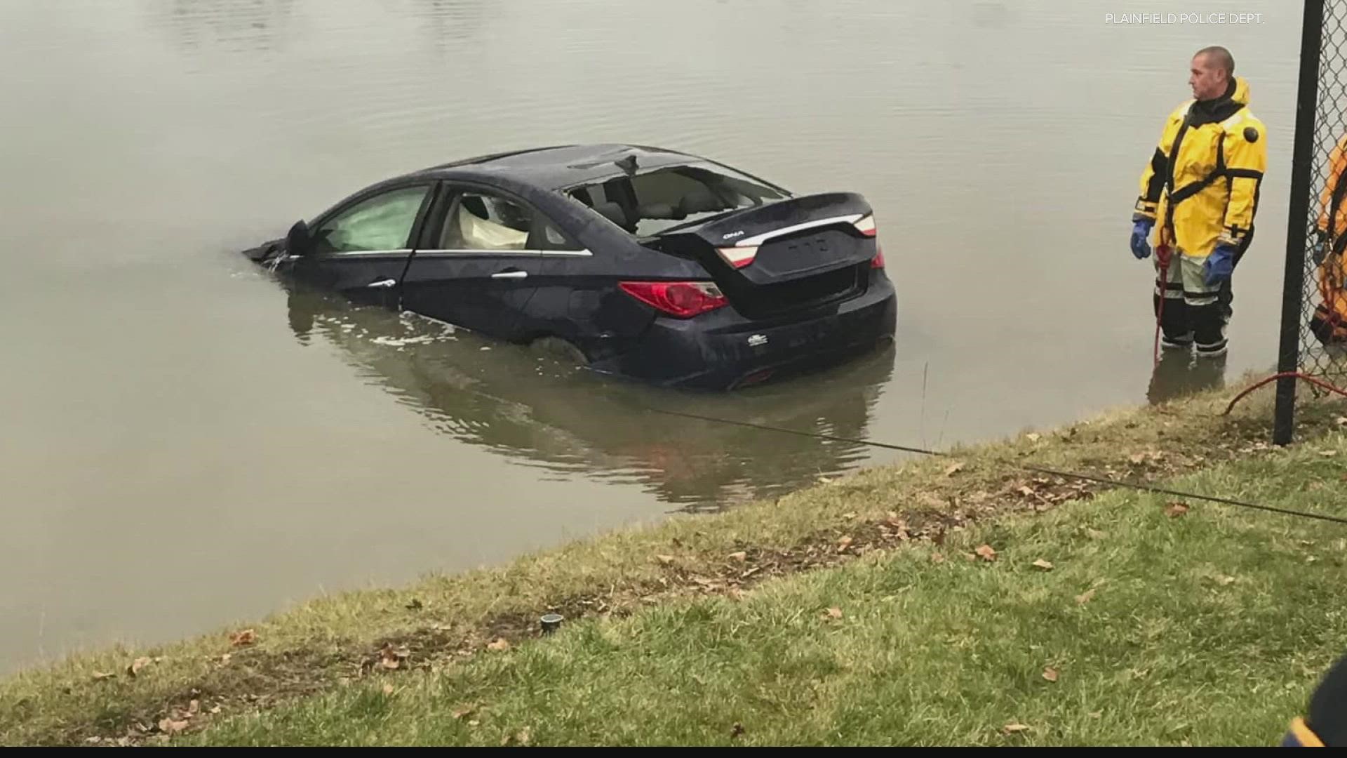The car crashed through fence and into a pond off Perry Road Tuesday morning.