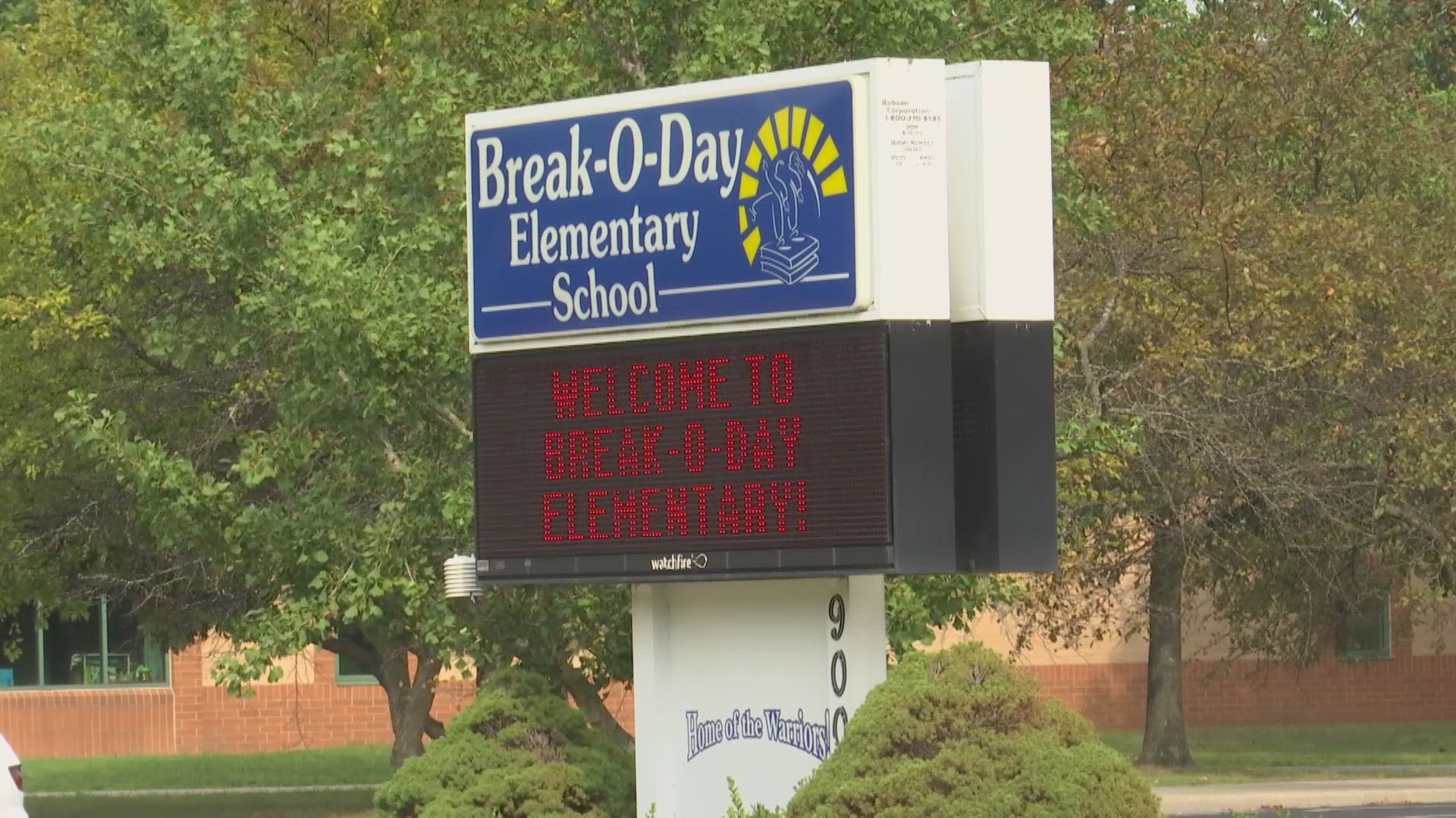 Students were waiting to get off the bus and go into school when another boy told the bus driver about the gun.