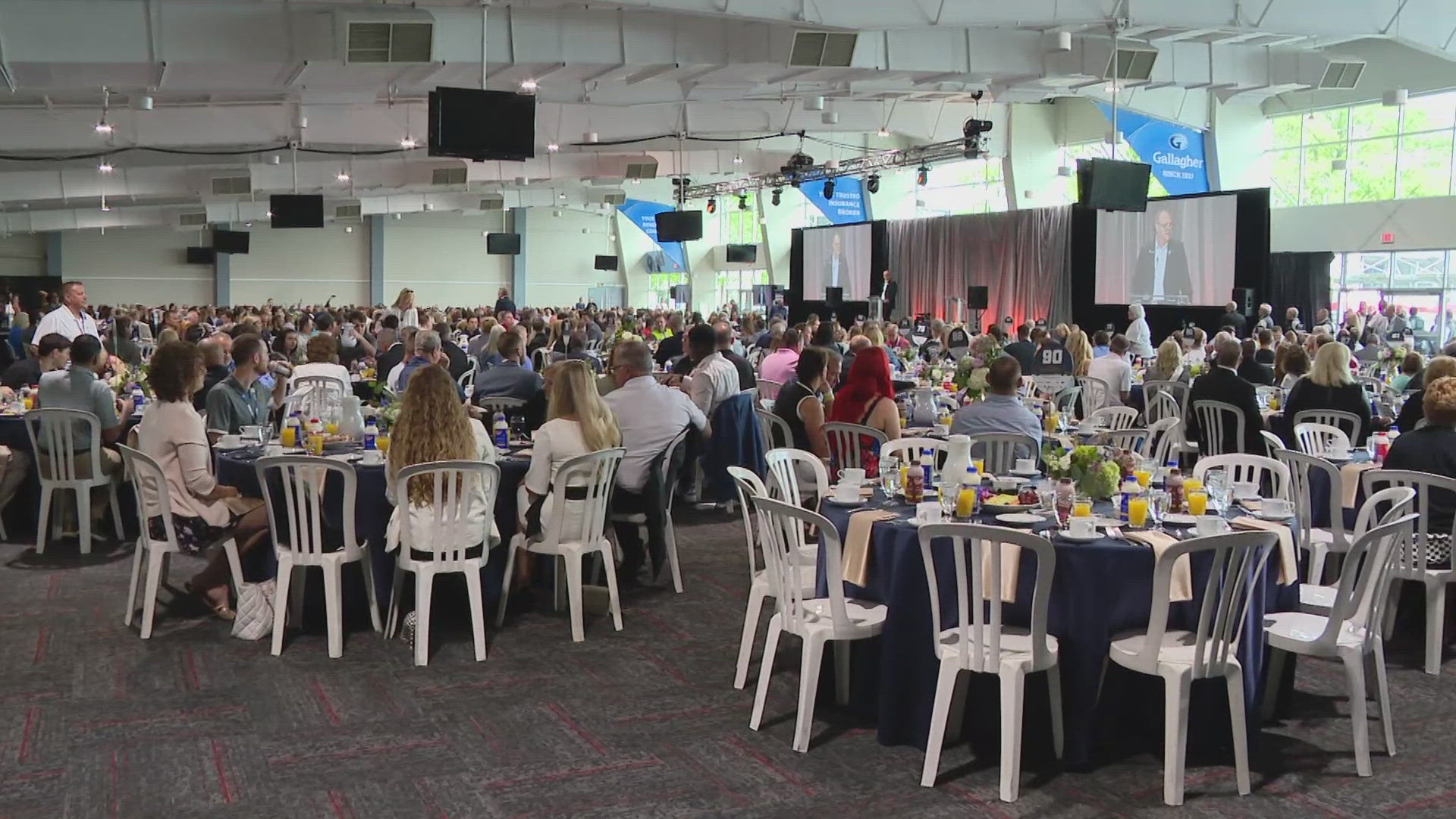 13News reporter Anna Chalker talks with attendees at the Breakfast at the Brickyard.