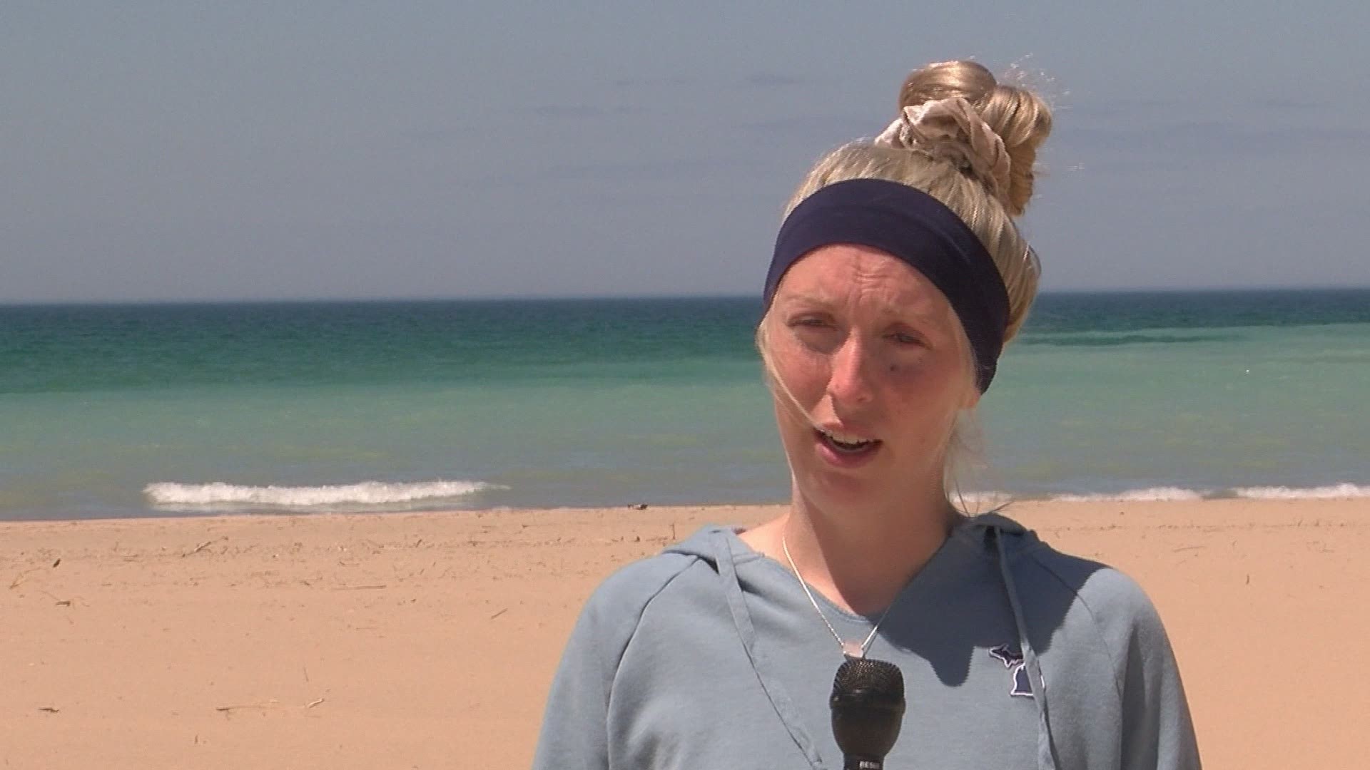 A Michigan woman — who is five months pregnant — is being hailed as a hero after saving three children from drowning in Lake Michigan.