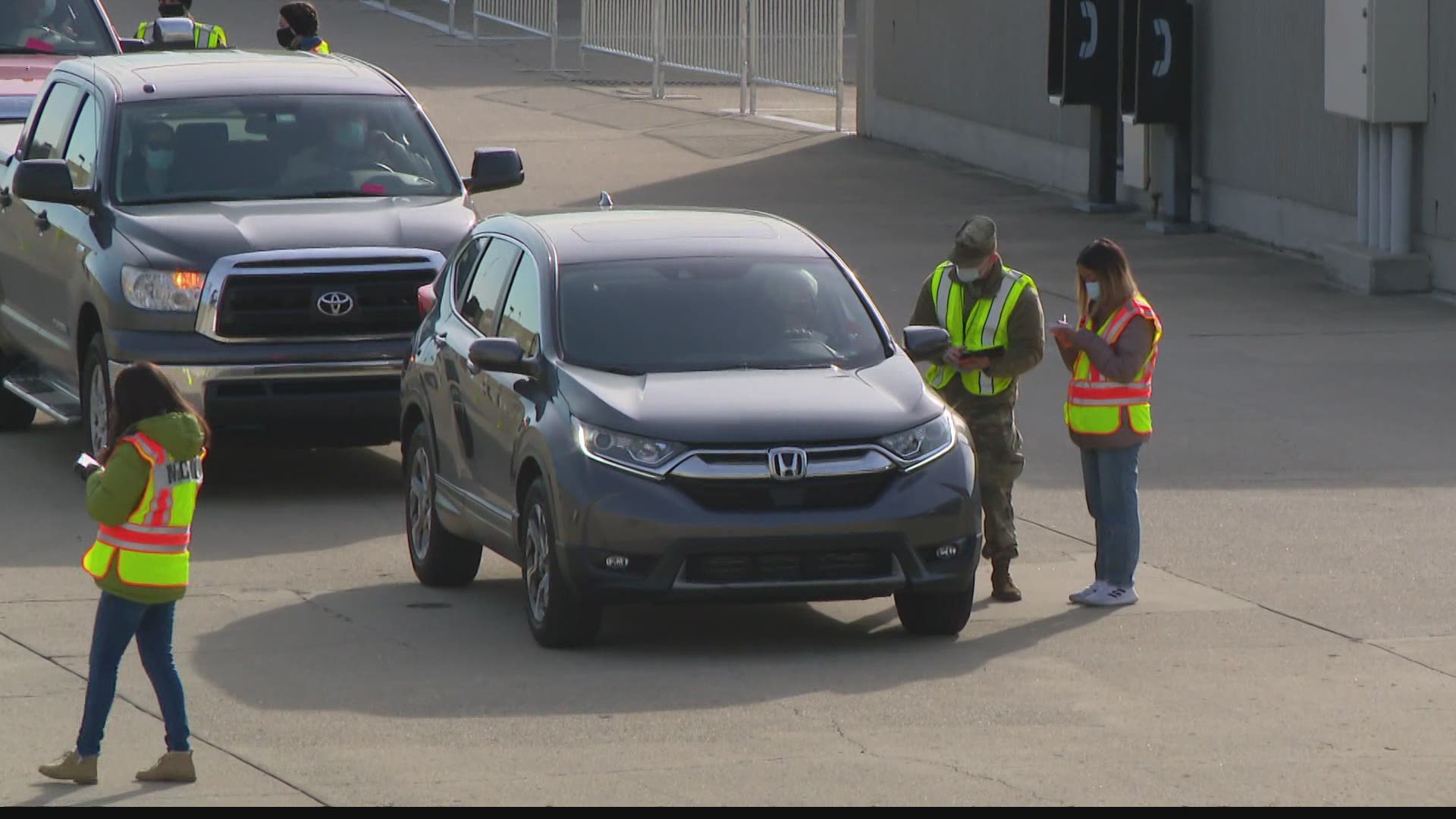 People lined up early Friday as the Indianapolis Motor Speedway began offering COVID-19 vaccinations.