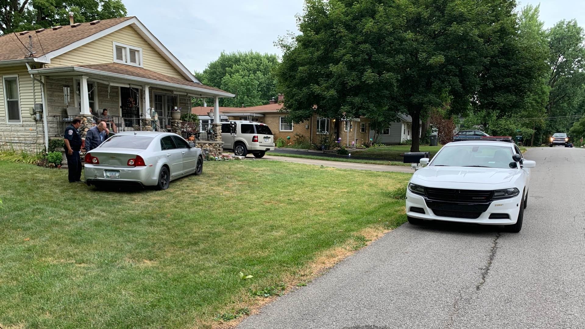 The people that live at the home told police they woke up and saw the car in their yard.